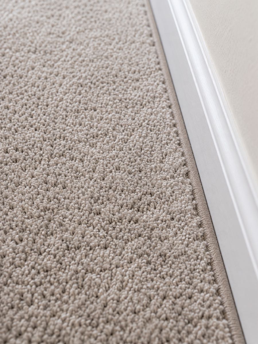 close-up of new carpet texture and edge binding