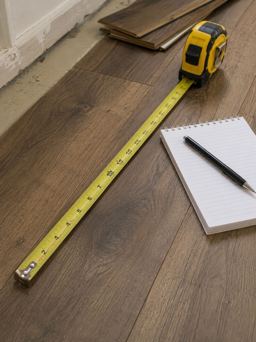 measuring a room ahead of a flooring installation estimate